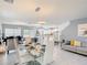 Open concept living space with dining area, kitchen, and comfortable seating at 511 Preserve Pointe Blvd, Davenport, FL 33837