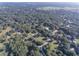 Expansive aerial view of a property nestled among mature trees, offering a serene and private setting at 5121 Shady Oak S Dr, Lakeland, FL 33810