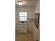Bathroom features a mirror, window, and a sink with white cabinet at 5121 Shady Oak S Dr, Lakeland, FL 33810
