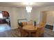 Bright dining room with chandelier lighting, wood flooring and access to the kitchen at 5121 Shady Oak S Dr, Lakeland, FL 33810