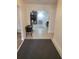 View of entryway with decorative tile flooring leading to a living room with fireplace feature at 5121 Shady Oak S Dr, Lakeland, FL 33810