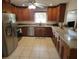 Well-appointed kitchen featuring stainless steel appliances, granite counters and wood cabinetry at 5121 Shady Oak S Dr, Lakeland, FL 33810