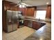 Well-appointed kitchen featuring stainless steel appliances, granite counters and wood cabinetry at 5121 Shady Oak S Dr, Lakeland, FL 33810