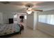 Large main bedroom with ceiling fans, an ensuite bathroom, and lots of closet space at 5121 Shady Oak S Dr, Lakeland, FL 33810