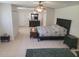 Large main bedroom with ceiling fans, an ensuite bathroom, and lots of closet space at 5121 Shady Oak S Dr, Lakeland, FL 33810