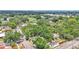 Scenic aerial view of a residential area with the house nestled among mature trees at 516 Windsor St, Lakeland, FL 33803