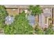 Aerial view of a residential area with mature trees, showcasing the house's roof and surrounding greenery at 516 Windsor St, Lakeland, FL 33803