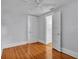 Clean bedroom with wood floors, three doors, and a ceiling fan at 516 Windsor St, Lakeland, FL 33803