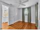Bright bedroom with a door leading to a bathroom and a ceiling fan at 516 Windsor St, Lakeland, FL 33803