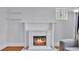 Electric fireplace with a decorative white brick surround and mantel at 516 Windsor St, Lakeland, FL 33803