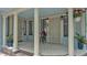 Inviting front porch with columns, white railings and space for outdoor decorations and seating at 516 Windsor St, Lakeland, FL 33803
