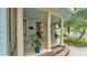 Inviting front porch with white columns, beautiful landscaping, and charming details at 516 Windsor St, Lakeland, FL 33803