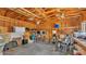 Spacious garage with exposed rafters shows plenty of storage and workspace at 516 Windsor St, Lakeland, FL 33803