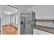 Bright kitchen with stainless steel appliances, hexagon tile backsplash, and white cabinets at 516 Windsor St, Lakeland, FL 33803