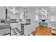Spacious kitchen featuring stainless steel appliances, black and white tile, and desk area at 516 Windsor St, Lakeland, FL 33803