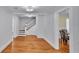 Living room showing hardwood floors, staircase, and entry to dining room at 516 Windsor St, Lakeland, FL 33803