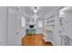 View of the office area featuring built-in cabinets and hardwood floors at 516 Windsor St, Lakeland, FL 33803