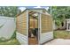 Open shed revealing gardening tools and storage supplies at 516 Windsor St, Lakeland, FL 33803