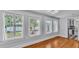 Sun room featuring hardwood floors, many windows, and nice natural light at 516 Windsor St, Lakeland, FL 33803