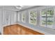 Sun room featuring hardwood floors, neutral walls, and many windows at 516 Windsor St, Lakeland, FL 33803