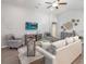 Stylish living room featuring a modern entertainment center, cozy seating, and tasteful decor, creating a welcoming atmosphere at 5424 Se 127Th Ln, Belleview, FL 34420