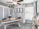 Charming home office with stylish desk, ample lighting, and a serene atmosphere for productivity at 5424 Se 127Th Ln, Belleview, FL 34420