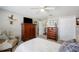 Comfortable bedroom features warm colors, a ceiling fan, two closets, and natural light from the window at 5425 Charlin Ave, Lakeland, FL 33810