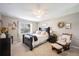 Relaxing bedroom featuring neutral walls, comfy furniture, decorations, and soft, plush carpet at 5425 Charlin Ave, Lakeland, FL 33810