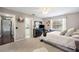 Stylish bedroom with a large dresser, TV, decorations, window and en-suite bathroom access at 5425 Charlin Ave, Lakeland, FL 33810