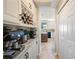 Elegant butler pantry with coffee station, wine rack, and easy access to the kitchen at 5425 Charlin Ave, Lakeland, FL 33810