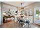 Inviting dining area with breakfast nook, farmhouse lighting, and access to the living room at 5425 Charlin Ave, Lakeland, FL 33810