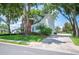 Charming home boasts mature trees, brick accents, and a well-maintained lawn at 5425 Charlin Ave, Lakeland, FL 33810