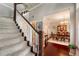 Welcoming foyer with staircase, hardwood floors, and view of the dining room at 5425 Charlin Ave, Lakeland, FL 33810