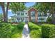 Charming home featuring a well-manicured front yard, lush landscaping, and a welcoming porch at 5425 Charlin Ave, Lakeland, FL 33810