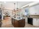 Well-lit kitchen with an island, stainless steel appliances, and a clear view into the living room at 5425 Charlin Ave, Lakeland, FL 33810