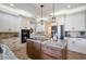 Spacious kitchen featuring a center island, stainless steel appliances, and plenty of cabinet storage at 5425 Charlin Ave, Lakeland, FL 33810