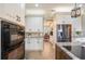 Modern kitchen with white cabinets, stainless steel appliances, granite countertops, and ample storage space at 5425 Charlin Ave, Lakeland, FL 33810