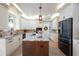 Bright kitchen with a center island, stainless steel appliances, and custom cabinetry for ample storage at 5425 Charlin Ave, Lakeland, FL 33810