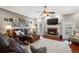 Comfortable living room with a cozy fireplace, hardwood floors, and neutral decor at 5425 Charlin Ave, Lakeland, FL 33810