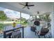 Large outdoor patio features overhead fans, patio seating, and backyard views at 5425 Charlin Ave, Lakeland, FL 33810