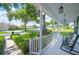 Inviting front porch featuring classic rocking chairs and decorative lighting, perfect for relaxing outdoors at 5425 Charlin Ave, Lakeland, FL 33810
