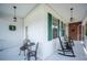 Charming front porch featuring rocking chairs and outdoor seating, creating a welcoming and relaxing atmosphere at 5425 Charlin Ave, Lakeland, FL 33810