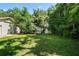 Spacious backyard, featuring a shed and lush green grass at 5425 Lewellyn Rd, Lakeland, FL 33810