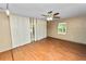 Comfortable bedroom with wood floors, window and ceiling fan offering a welcoming atmosphere at 5425 Lewellyn Rd, Lakeland, FL 33810