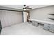 Bedroom featuring carpeted floors, large closet, and vanity desk with shelves at 5425 Lewellyn Rd, Lakeland, FL 33810