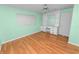 Bedroom featuring hardwood floors and vanity desk with shelves at 5425 Lewellyn Rd, Lakeland, FL 33810