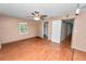 Cozy bedroom featuring wood floors, a ceiling fan, and neutral walls creating a peaceful space at 5425 Lewellyn Rd, Lakeland, FL 33810