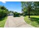 Long driveway leading up to the home and detached garage at 5425 Lewellyn Rd, Lakeland, FL 33810