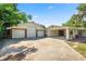 Home exterior features multiple garages and a carport at 5425 Lewellyn Rd, Lakeland, FL 33810