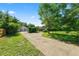 Well-maintained front yard leading to a two car garage and home at 5425 Lewellyn Rd, Lakeland, FL 33810